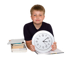 Boy looking at a clock